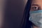 2019-ncov outbreak concept. Cropped close up photo portrait of terrified frightened feeling bad human wearing facial mask isolated