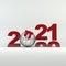2020-2021 change represents the new year 2021. Silver ball decorated with ribbon. Christmas and New Year 2021 decoration