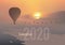 2020 calendar ready to print in French version, showing sunsets on landscapes overflighted by balloons.