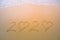 2020 handwritten numeric text on the sand by the beach, Numbers 2020 year on the sand, Happy New Year 2020, Zeros represented by