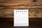 2020 March. White paper calendar on a wooden table