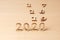 2020 new year change 2019, 2018 and 2017. Wooden numbers on a light table symbolize the change of years