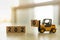 2020 New year concept. Close up of toy forklift truck machine car loaded  number 0 wooden block toy on table with copy space