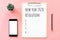 2020 New year concept. Resolution list in stationery, blank clipboard, smartphone, pot plant on pink pastel color with copy space