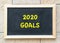 2020 new year goal, plan, action text on black board