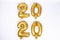 2020 number of frustrated gold balloons isolated on white background. Happy new year 2020 holiday