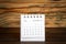 2020 OCTOBER. White paper calendar on a wooden table. Time planning