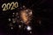 2020 Text with Festive Gold Fireworks Collage in Night Sky. Copy space. Greeting card
