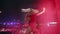 2021-08-08 - Mariupol City Festival, Ukraine. Energetic singer performs at night in red lights at beach festival. Blonde