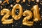 2021 balloon gold text on black background with golden confetti, Christmas gift boxes festive decor. Happy New year eve