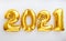 2021 balloon text on white background. Happy New year eve invitation with Christmas gold foil balloons 2021. Flat lay long web