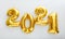 2021 balloon text on white background. Happy New year eve invitation with Christmas gold foil balloons 2021. Flat lay long web