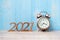 2021 Happy New Year  with retro alarm clock and wooden number. New Start, Resolution, Goals, Plan, Action and Mission Concept