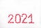 2021 lined with red glittering hearts on white background. New Year. Place for text. Copy space