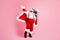 2021 x-mas christmas party start. Full body photo crazy bearded overweight santa claus big belly dance raise finger hold