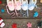 2021 new year written laces of children`s shoes and pacifier on old wooden background. Top view.