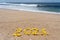 2021 Numbers written on sand by Flowers. Ocean wave blue sky background.