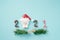 2021 from smiling face Santa Claus doll with candy cane and branch of pine tree on grunge blue background for greeting season