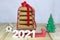 2021, a symbol of the approaching New Year, a stack of homemade gingerbread on a small sled. Conceptual holiday background
