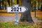 2021 written on an old french roadsign fall background