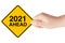 2021 Year Ahead Traffic Sign in Woman`s Hand