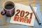 2021 year review on napkin with coffee