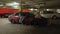 2022.04.24. Warsaw, Poland. destroyed red car full of trash in the parking garage