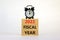 2022 fiscal new year symbol. Concept words `2022 fiscal year` on wooden blocks. Black alarm clock. Beautiful white background.