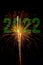 2022 green digits on a black background with glowing fireworks