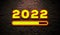 2022 loading neon number Style on dark brick wall with loading bar. happy new year 2022 concept. Glowing Yellow Text and Neon sign
