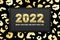 2022 Merry Christmas and Happy New Year greeting card design with shiny golden numbers and gold leopard pattern on black