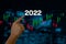 2022 New year candlestick graph chart auto trade, business finance investment stock exchange market concept background