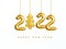 2022 New Year card. Design of Christmas decorations hanging on a gold chain gold number 2022 and Christmas Tree. Lettering Happy