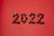 2022 numbers made from chestnuts on a red background