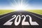 2022 road perspective with rising sun new year card