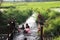 2023-05-01:Lampang Thailand:Many children were having fun playing in the small canal at the rice fields