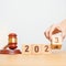 2023 chcnge to 2024 year block with judge gavel on table. Law, lawyer, judgment, justice auction and bidding concept