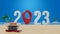 2023 number on sand beach with blue sky and white clouds abstract background