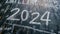 2024 date handwritten in a chalk writing text script on a wooden black chalkboard