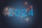 2024, Fireworks next to the number 2024 on blue background. Happy New Year