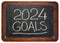 2024 goals - handwriting in chalk on a vintage slate blackboard, New Year goals and resolutions concept