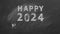 2024 HAPPY NEW YEAR written in chalk on a blackboard