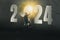 2024 new year numbers on wall, opportunity businessman standing on staircase to looking keyhole door, leader concept vision and