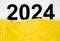 The 2024 number inside yellow paper torn. Preparation 2024 year concepts