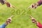 2024, People pointing to the number 2024 on green background. Happy New Year