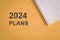 2024 Plans with notepad. Top view