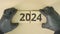 2024 text on cardboard jigsaw puzzle pieces