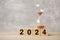 2024 text with hourglass on table. Resolution, time, plan, goal, motivation, reboot, countdown and New Year holiday concepts