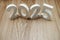 2025 Happy New Year with space copy on wooden background