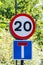 20mph speed limit and end of road sign on a post